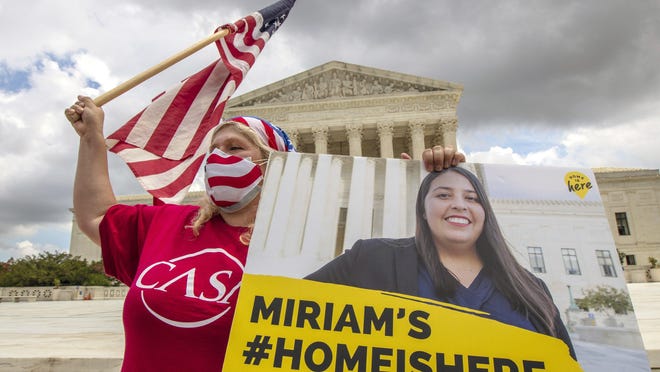 Ivania Castillo from Prince William County, Va., shows her support for dreamer Miriam from California, as she joins DACA recipients in front of the U.S. Supreme Court.
