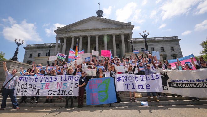 Ohio shouldn't follow the lead of states that have passed or are considering legislation about what bathrooms transgendered people can use, The Enquirer editorial board writes. Shown, college students hold a rally at the South Carolina State Capitol in April to protest a bill that would ban transgender people from choosing the bathroom they use.