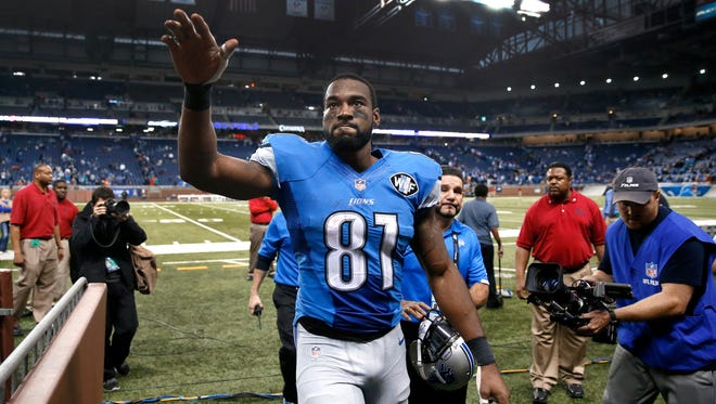 FILE - In this Nov. 9, 2014, file photo, Detroit Lions wide receiver Calvin Johnson waves to fans after defeating the Miami Dolphins 20-16 in a NFL football game in Detroit. Calvin Johnson has retired. The 30-year-old receiver, known as Megatron, announced his decision Tuesday, March 8, 2016, to walk away from the NFL after nine mostly spectacular seasons with the Detroit Lions. (AP Photo/Paul Sancya, File)