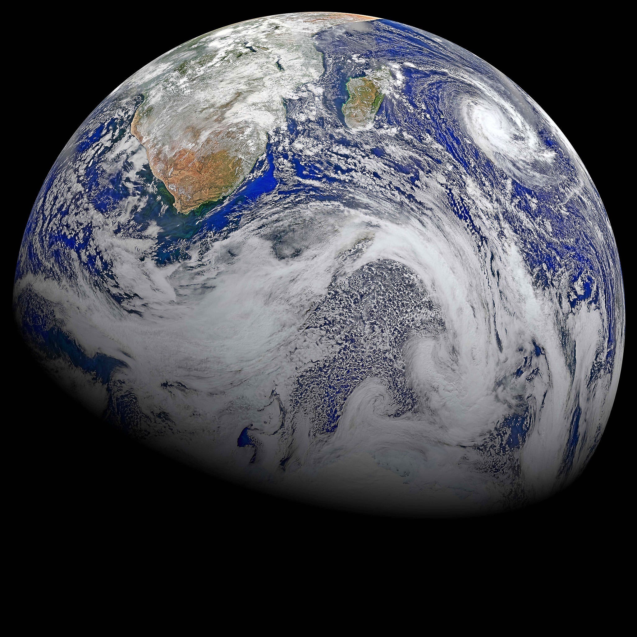 This image provided by NASA Data from six orbits of the Suomi-NPP spacecraft on April 9, 2015 have been assembled into this perspective composite of southern Africa and the surrounding oceans.  Tropical Cyclone Joalane is seen over the Indian Ocean. The image was created by the Ocean Biology Processing Group at NASA's Goddard Space Flight Center in Greenbelt, Maryland. (NASA via AP) ORG XMIT: NY107