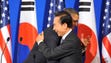 President Barack Obama (L) embraces South Korean President