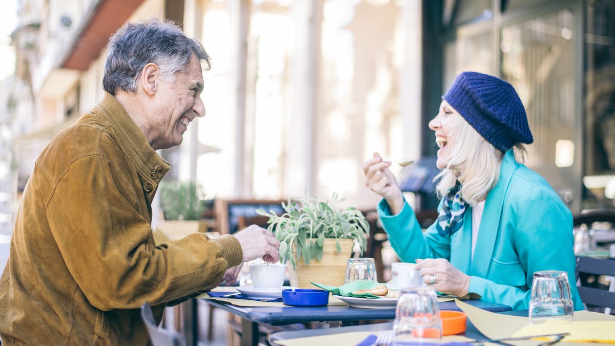 Older man and woman dining out
