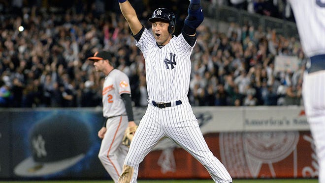 Yankees shortstop Derek Jeter celebrates his walk-off single tonight in New York.