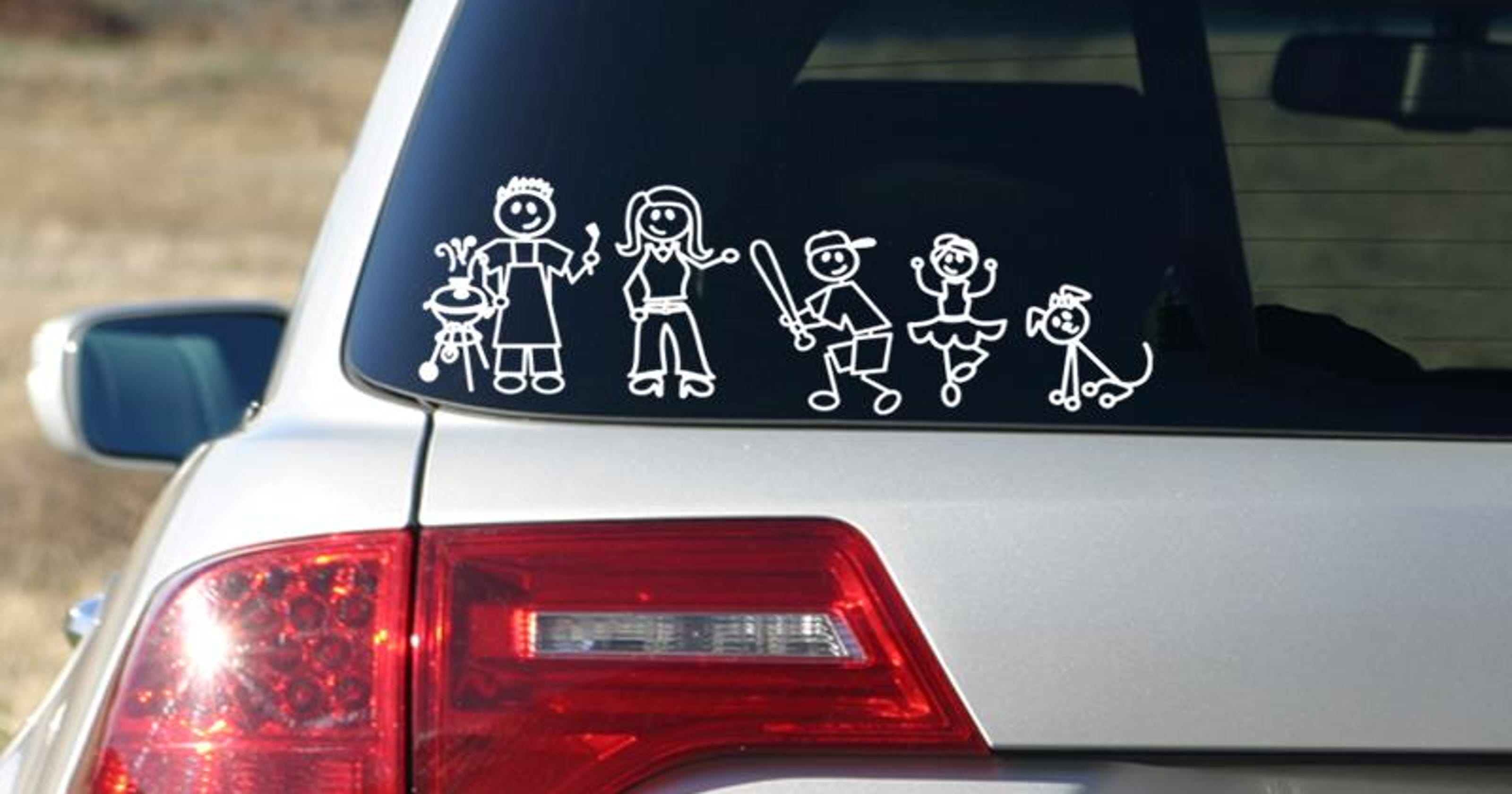 Stick-figure family car decals: Are they dangerous?