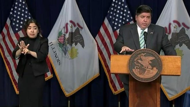 Gov. JB Pritzker expresses concern over the rising number of COVID-19 cases and an increase in the rate of positive test results in recent days during a news conference Wednesday in Chicago.