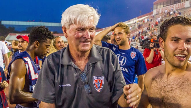 Indy Eleven coach Tim Hankinson celebrates with his team after they likely clinched the North American Soccer League Spring Season title with a 4-1 win Saturday against Carolina.