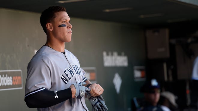 New York Yankees' Aaron Judge looks on from the dugout during the fourth inning of a baseball game against the Baltimore Orioles, Sunday, Sept. 4, 2016, in Baltimore.