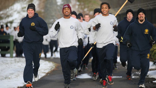 Chase Coleman, second from left,  runs with police recruits at the Public Safety Training Facility.  Chase, who is nonverbal,  was treated roughly while running in Cobbs Hill in October and was invited by the recruiting class to run with them.