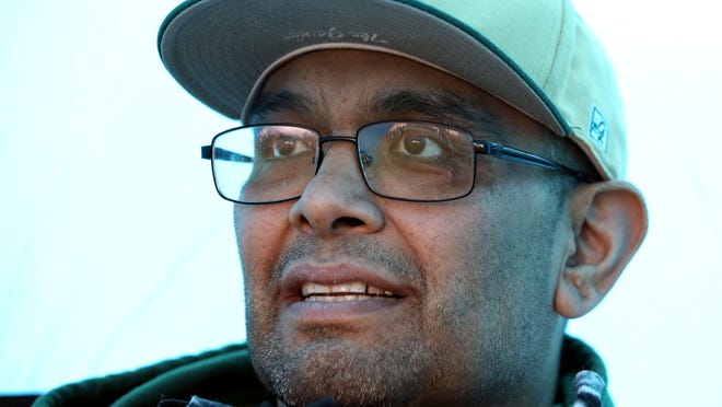 Pancho Tavera, a long-time youth baseball coach and assistant high school coach, is dying of cancer at age 42, watches his son, who plays on McKay's baseball team play West Salem on Tuesday, April 7, 2015, in Salem.