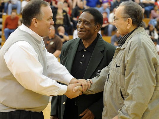 Oak Grove boys basketball head coach Jay Ladner is congratulated by former Oak Grove coach Harry Breland, center, and former Southern Miss head coach M.K. Turk for achieving 500 wins in his career in this 2013 Hattiesburg American file photo.