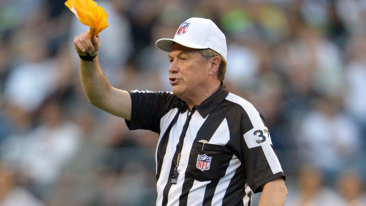 Aug 30, 2012; Seattle, WA, USA; NFL replacement referee Jerry Frump (37) waves a penalty flag during the game between the Oakland Raiders and Seattle Seahawks at CenturyLink Field. Mandatory Credit: Kirby Lee/Image of Sport-US PRESSWIRE ORG XMIT: USPW-82384 ORIG FILE ID:  20120830_mje_al2_649.jpg