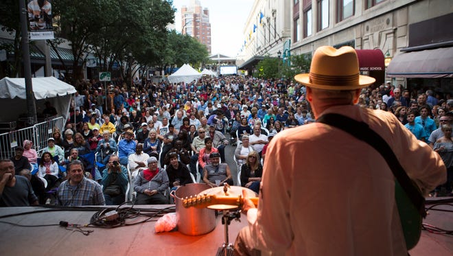 A large crowd enjoys music by Sauce Boss on the Jazz Street Stage during the first night of the Xerox Rochester International Jazz Festival on Friday, June 19, 2015.