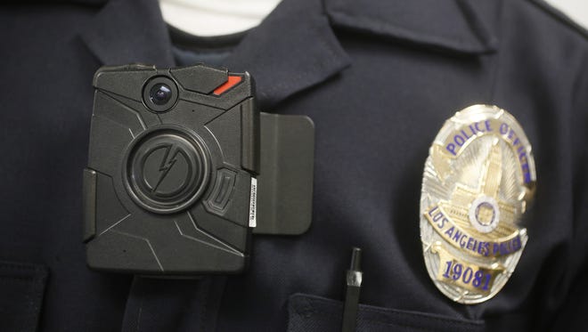 A Los Angeles Police officer wears an on-body camera during a demonstration in Los Angeles.