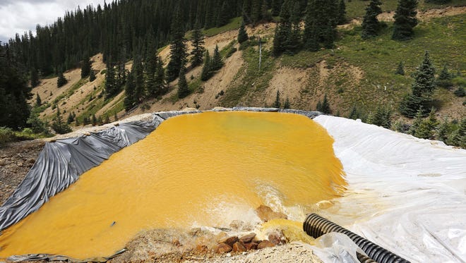 Water flows through a series of retention ponds on Aug.12, 2015, after a spill at the Gold King mine near Silverton, Colorado.