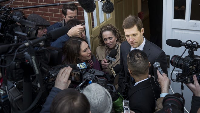 Conor Lamb, Democratic congressional candidate for Pennsylvania's 18th district, is surrounded by members of the media after voting at his polling station at First Church of Christ, March 13, 2018 in Mt. Lebanon, Pennsylvania. Voters head to the polls today as Lamb is running in a tight race for the vacated seat of Rep. Tim Murphy (R-PA) against Republican candidate Rick Saccone.
