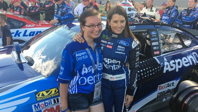 Tomahawk resident Gabrielle Jahn, left, poses with NASCAR driver Danica Patrick at the Daytona Speedway on July 1.