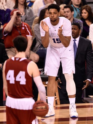 Duke Blue Devils center Jahlil Okafor (15) celebrates on the bench during the second half against the Wisconsin Badgersin the 2015 NCAA Men's Division I Championship game at Lucas Oil Stadium.