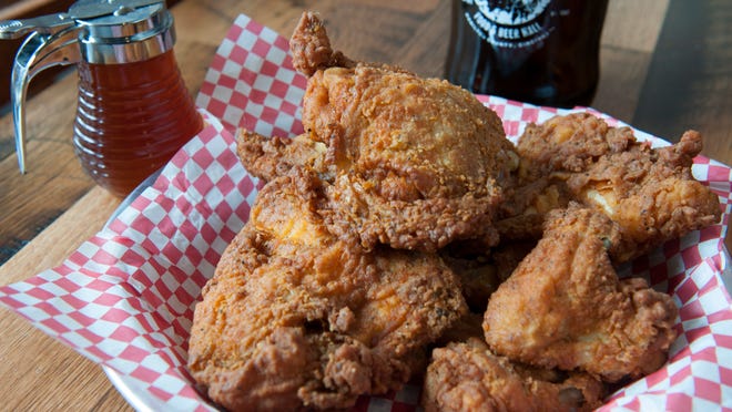 A basket of the all-natural, free range, Amish fried chicken, served with spicy hot honey, at The Eagle OTR.