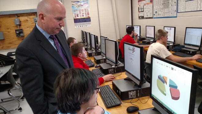 Gov. Jack Markell observes an electrical construction dual-enrollment course at Polytech High School.