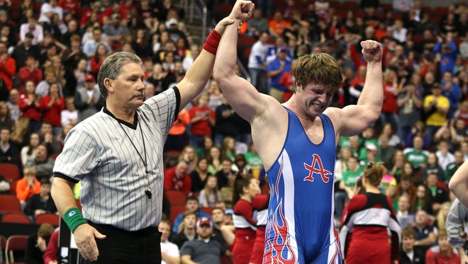 Bryon Houlgrave/The Register
Carter Isley of Albia is a multi-sport star, having led Class 2-A football in rushing, a state title in wrestling and had the best record on the school's tennis team.
Albia junior Carter Isley celebrates after he won the title at 220 pounds in Class 2A over Hampton-Dumont senior Kendrick Suntken on Saturday, Feb. 21, 2015, during the 2015 Iowa state wrestling championships at Wells Fargo Arena in Des Moines, Iowa.