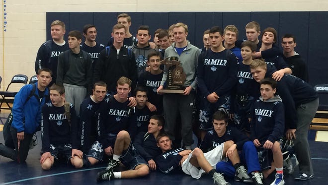 The Richmond wrestling team poses after winning its 10th consecutive regional championship