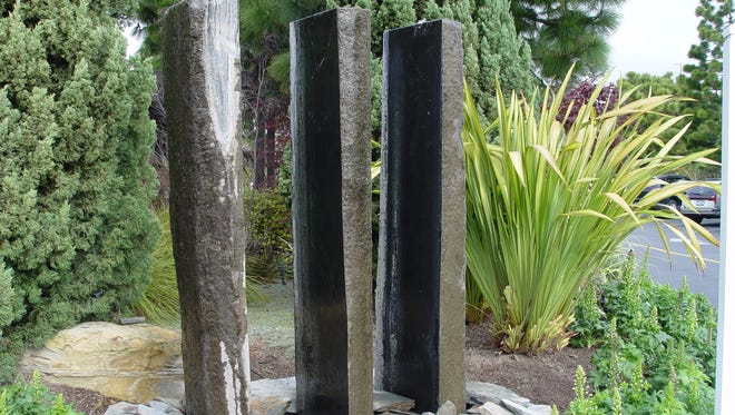 Five-foot tall basalt pillars are large and monolithic, capable of changing the entire feel of a small courtyard with water.
