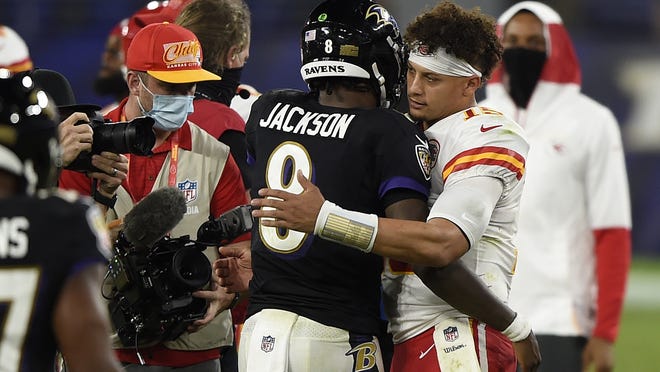 Baltimore Ravens quarterback Lamar Jackson and Kansas City Chiefs quarterback Patrick Mahomes embrace after Monday night's game in Baltimore. The Chiefs won, 34-20.