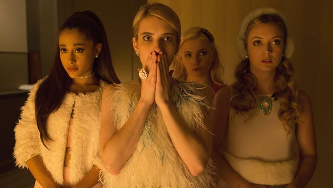 In this image released by Fox, Ariana Grande, from left, Emma Roberts, Abigail Breslin and Billie Lourd appear in a scene from “Scream Queens,” premiering Sept. 22 on Fox.