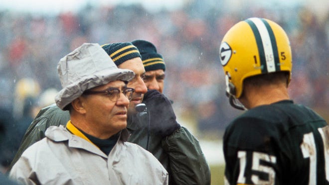 Jan 2, 1966; Cleveland, OH, USA; FILE PHOTO; Green Bay Packers head coach Vince Lombardi talks to quarterback Bart Starr (15) against the Cleveland Browns during the 1965 NFL Championship game at Cleveland Stadium. Mandatory Credit: David Boss-USA TODAY Sports