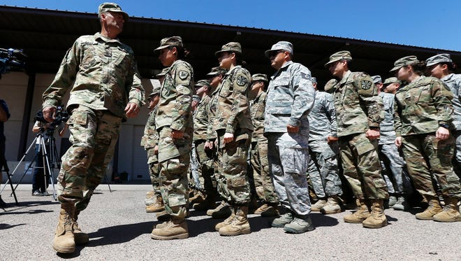 Arizona National Guard soldiers line up as they get ready for a visit from Arizona Gov. Doug Ducey prior their deployment to the Mexico border at the Papago Park Military Reservation Monday, April 9, 2018, in Phoenix.