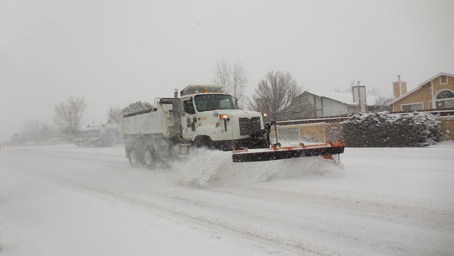 A snowplow clears a road during a past storm on Sharlands Avenue in northwest Reno.