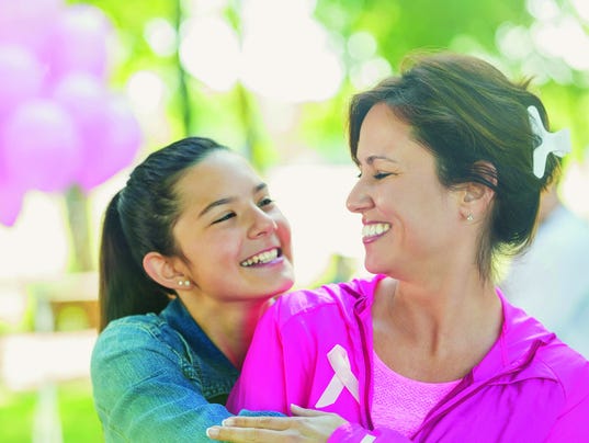 Mother and preteen daughter at breast cancer awareness charity race