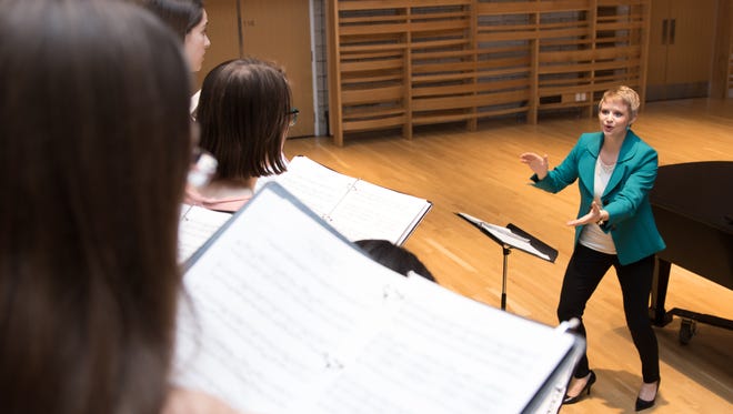 Faculty member Danielle Steele leads choral students at Earlham College's Center for Visual and Performing Arts.