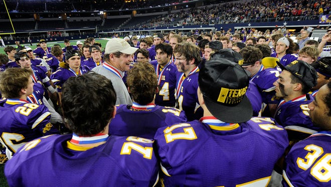 Wylie head coach Hugh Sandifer talks to his players after the Bulldogs' 31-17 loss to Carthage in the Class 4A Div. I state championship game on Friday, Dec. 16, 2016, at AT&T Stadium in Arlington. 