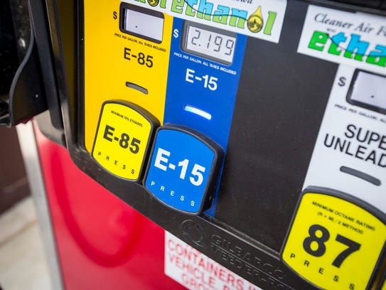 Jack Vermeer, 15, puts E15 fuel in his 2014 Ford Focus