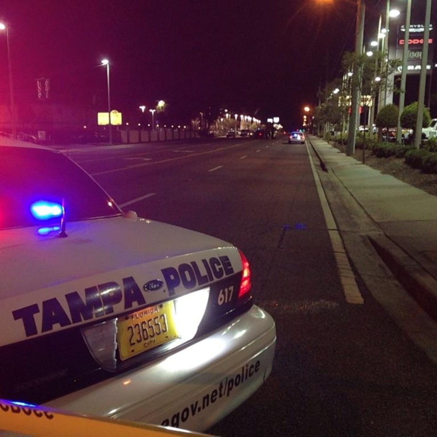 Tampa Police Department officers in the northern part of the city where a 4-year-old boy was found injured July 20, 2014, in the middle of the road.