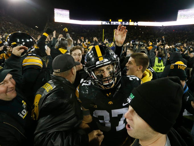Players and fans celebrate Saturday, Nov. 12, 2016,