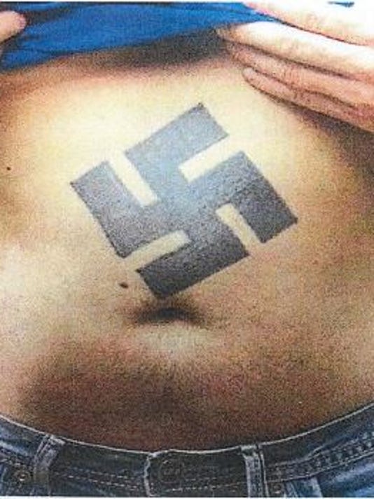 Roses &amp; thistles Dubuque tattoo artist offers free removal of hateful ink