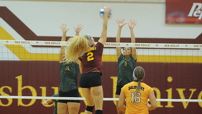 Katie Stouffer leaps above the net for an attempt at a kill against McDaniel on Friday, Sept. 9, 2016 at Maggs Physical Activity Center.