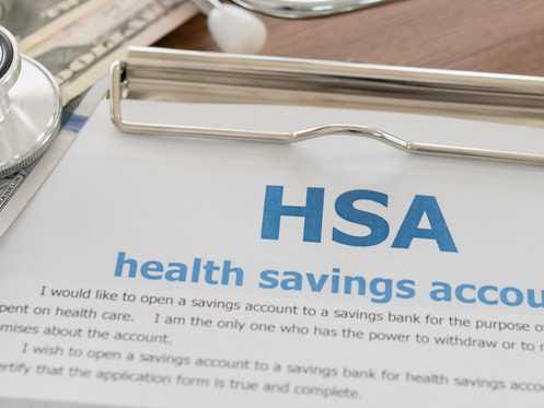 HSA paperwork with money on top.