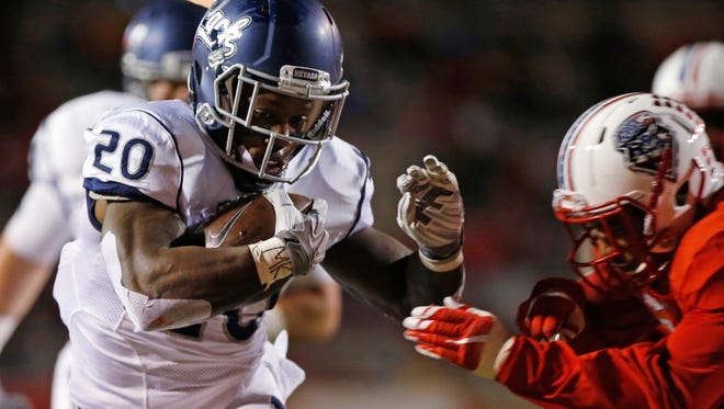 Nevada running back James Butler scores a touchdown against New Mexico last week. He faces one of the nation's top run defense, San Diego State, on Saturday.