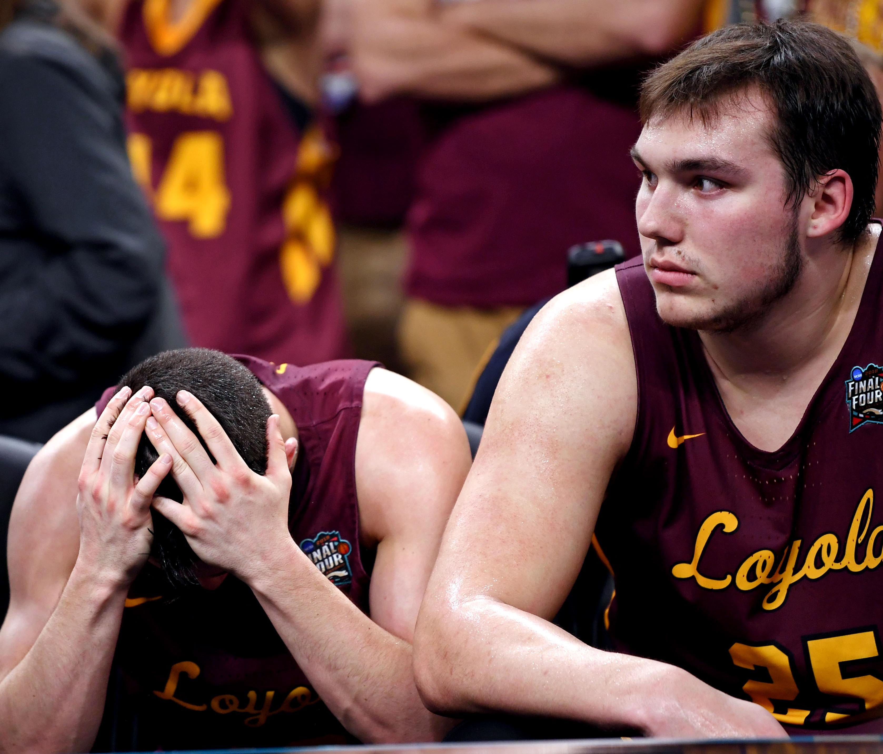 Loyola Ramblers guard Clayton Custer (13) and center Cameron Krutwig (25) react on the bench during the second half against the Michigan Wolverines in the semifinals of the 2018 men's Final Four at Alamodome.