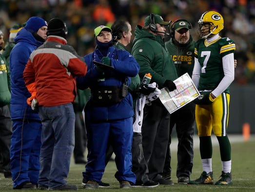 Green Bay Packers quarterback Brett Hundley talks with