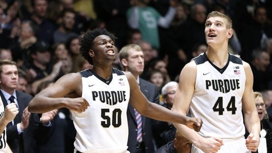 Caleb Swanigan and Isaac Haas react on the Purdue bench during Purdue's OT win over Michigan State.