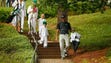 Bubba Watson walks with his wife and children during