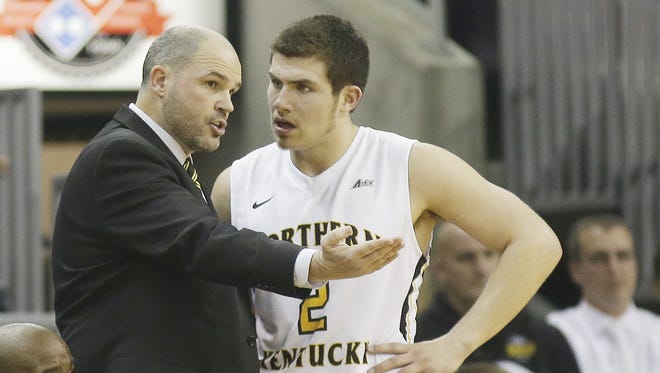 NkU coach Dave Bezold talks with Tayler Persons during the Norse's game against West Virginia.