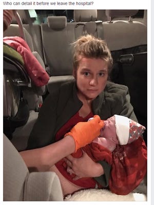 Mindi McGlynn posted this picture of herself on Facebook with the caption, "I had a baby in my car last night (seriously, not even kidding). Who can detail it before we leave the hospital?"