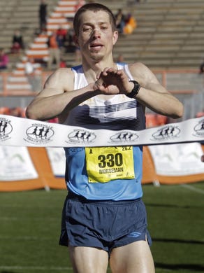 Marathon winner, Bryan Morseman, crosses the finish line in Neyland Stadium during the Covenant Health Knoxville Marathon Sunday, April 3, 2016. (WADE PAYNE/SPECIAL TO THE NEWS SENTINEL)
