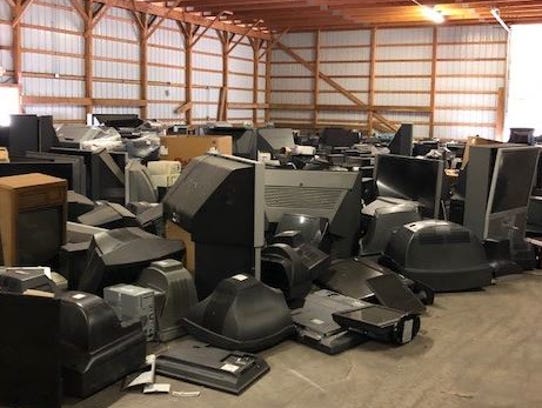 Tons of old televisions wait to prepared for recycling