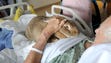 Robert Moss, of Thousand Oaks, pets Henry, a Flemish